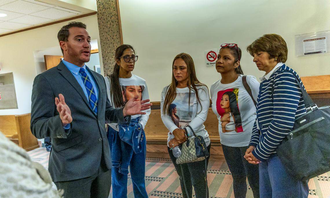 Prosecutor Shawn Abuhoff  talks to family members of the victims after a plea hearing for defendant Maiky Simeon who is accused in the deaths of five young people in a wrong-way crash on the Palmetto Expressway in 2022, at the Gerstein Justice Building, in Miami on Friday, April 24, 2026.