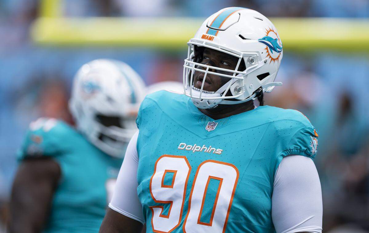 Miami Dolphins defensive tackle Kenneth Grant (90) runs drills before playing against the Carolina Panthers in their NFL game at the Bank of America Stadium on Sunday, Oct. 5, 2025, in Charlotte, N.C.