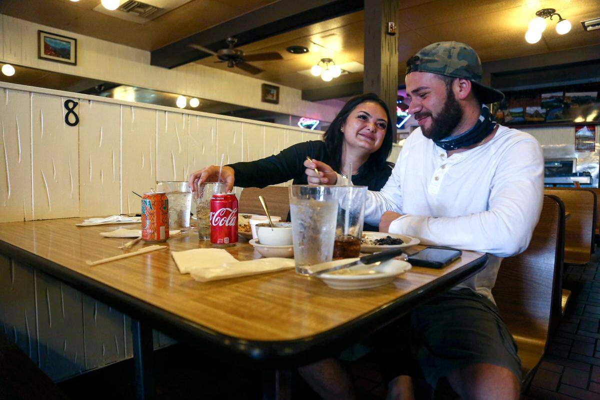 Nathalie Garcia, 19, and Joshua Wainright, 22, enjoy lunch at Rio Cristal Restaurant during the first day of reopening for indoor dining in Westchester on Aug. 31.