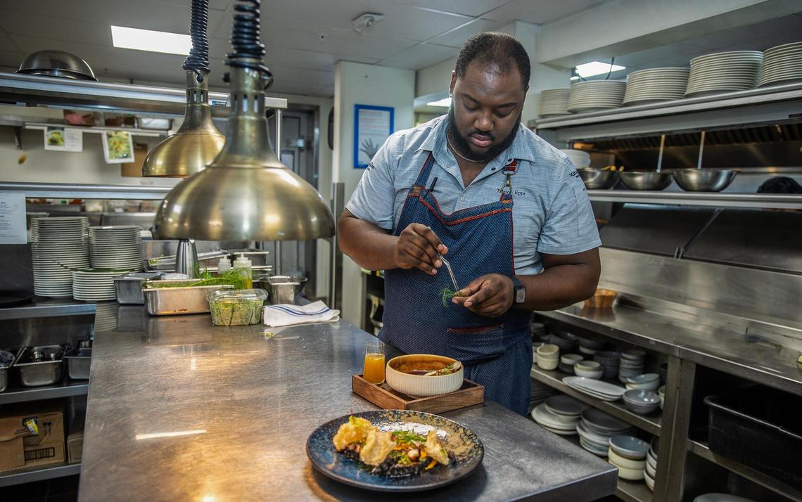 Chef Tristen Epps prepares some dishes in the kitchen at Ocean Social at the Eden Roc Miami Beach.