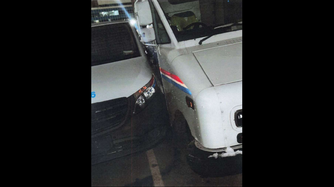 Two of the three damaged USPS vehicles.