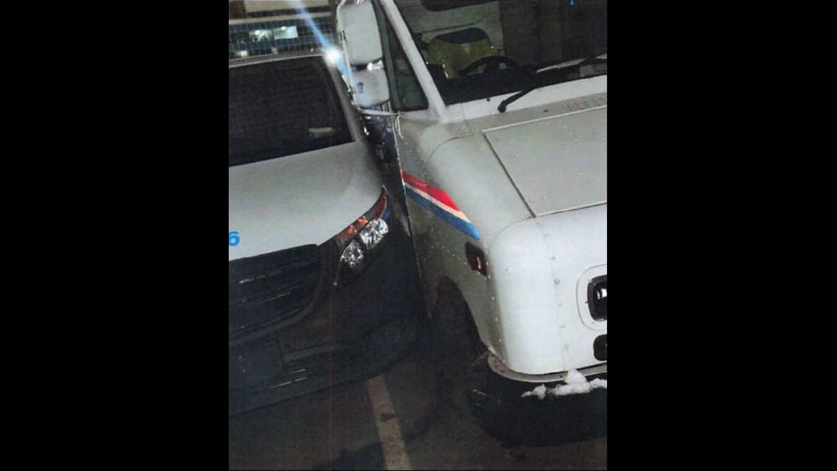 Two of the three damaged USPS vehicles.