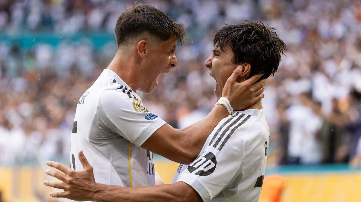 Real Madrid CF forward Gonzalo Garcia (30) celebrates with midfielder Arda Guler (15) after scoring a header against Juventus in the second half of their round of 16 FIFA Club World Cup soccer match at Hard Rock Stadium on Tuesday, July 1, 2025, in Miami Gardens, Fla.