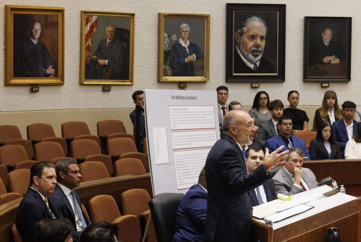 Mayor Francis Suarez and City Attorney George Wysong, left, sitting the front row while Alan Lawson, attorney for Emilio González, right, speaks during a hearing at the Third District Court of Appeal for a case Emilio González brought against the City of Miami on Tuesday, July 29, 2025, in Miami.
