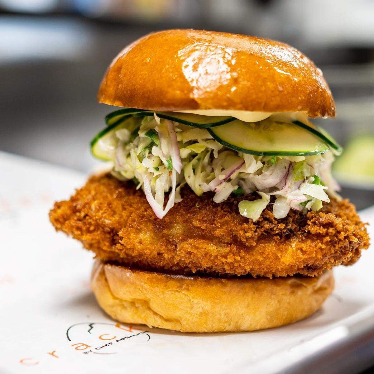 The free-range chicken sandwich at Cracked by Chef Adrienne may be hard to stuff in your mouth, but you are going to want to try.