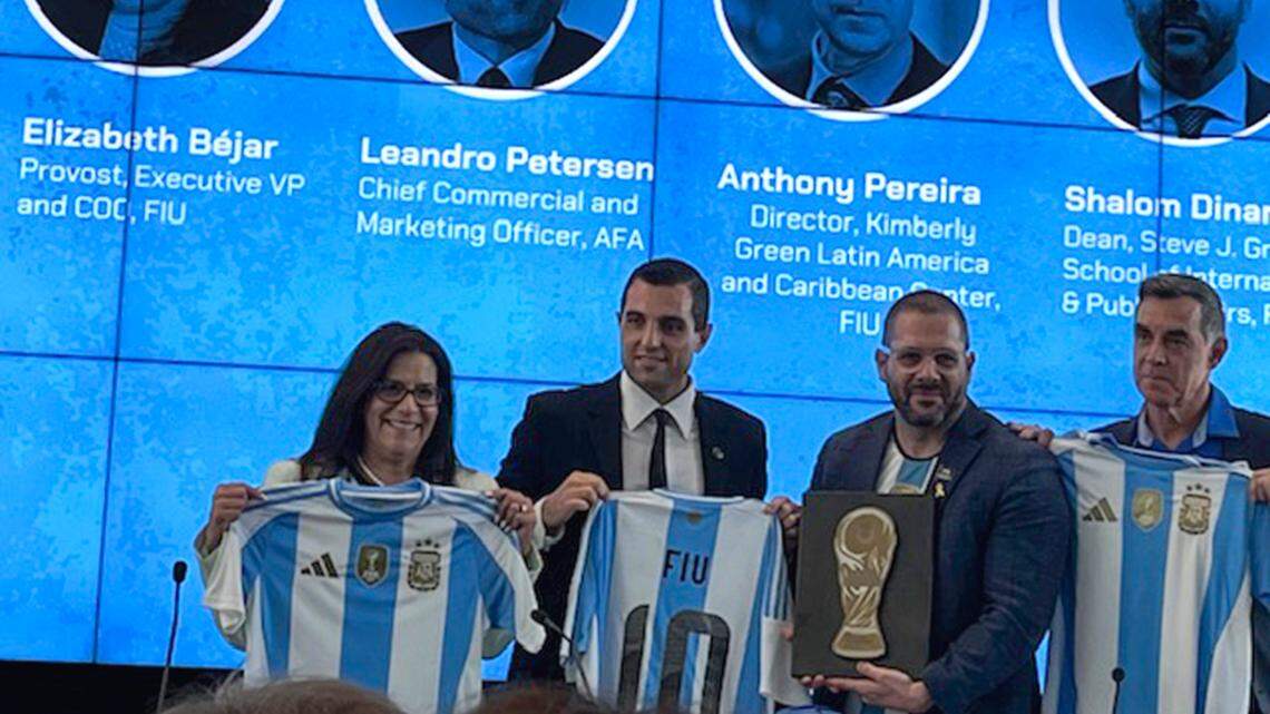 FIU officials Elizabeth Bejar (far left), Shlomi Dinar (holding plaque), Anthony Pereira (far right) and Asociacion de Futbol Argentino chief commercial and marketing officer Leandro Petersen announce the joint launch of a 10-week sports leadership program.