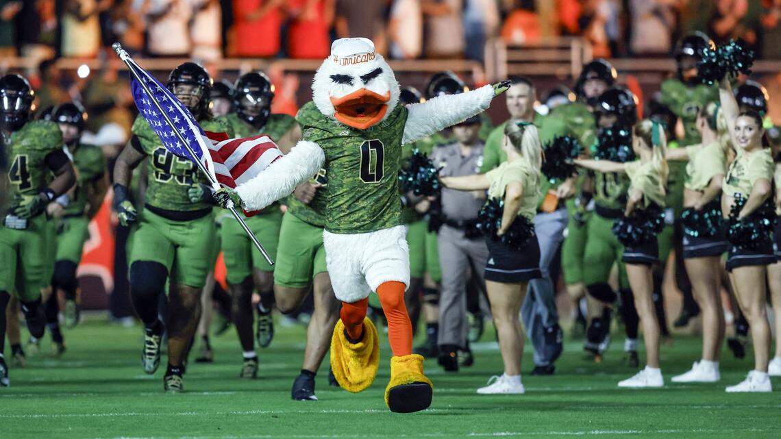 Sebastian the Ibis leads the Miami Hurricanes as they rush the field for their NCAA football game against Stanford Cardinal at Hard Rock Stadium in Miami Gardens, Florida, on Saturday, October 25, 2025.