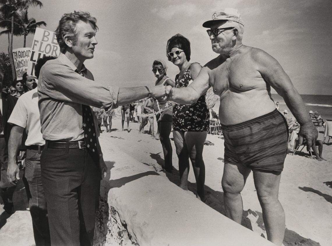 In 1972, New York Mayor John V. Lindsay, campaigning for U.S. president on South Beach, shakes hands with Sam Gross, from New York City.