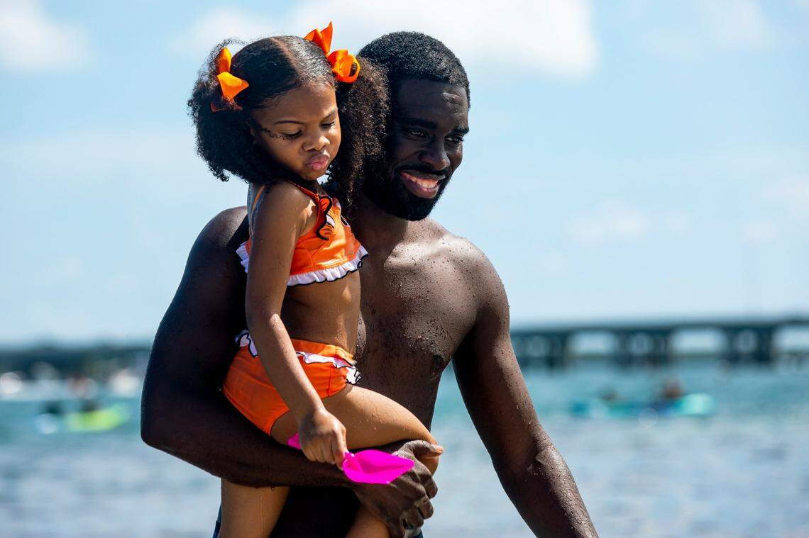 Donoven Jackson and his daughter Naomi at Historic Virginia Key Beach during its 75th anniversary celebration in 2020.