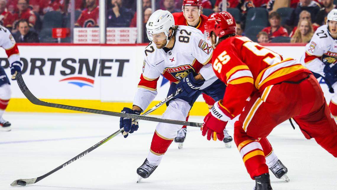 Dec 18, 2023; Calgary, Alberta, CAN; Florida Panthers center Kevin Stenlund (82) controls the puck against the Calgary Flames during the second period at Scotiabank Saddledome. Mandatory Credit: Sergei Belski-USA TODAY Sports