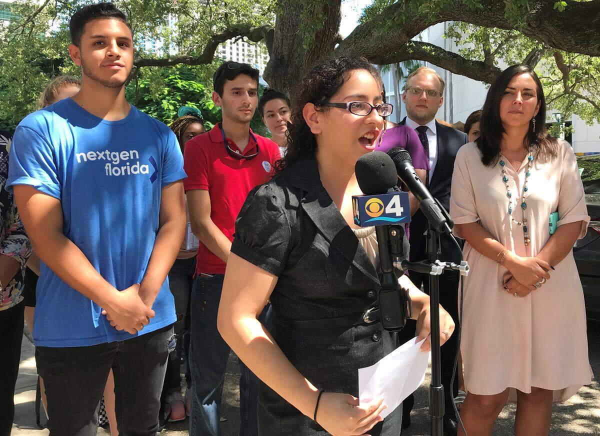 Florida International University student Samantha Skhir urges Miami-Dade County to open an early-voting site on her campus in October as she speaks during a press conference outside of County Hall on Thursday, Sept. 13, 2018. Behind her are other advocates for the early-voting site, from left: William Joel Bravo, of NextGen Florida; Andres Solorzano, president of FIU’s College Republicans chapter; Dan Horton, Florida state director of All Voting is Local; and Andrea Mercado, director of New Florida Majority.