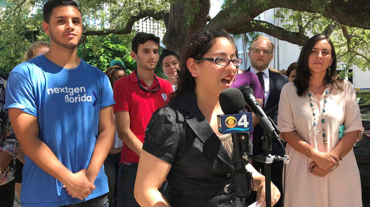 Florida International University student Samantha Skhir urges Miami-Dade County to open an early-voting site on her campus in October as she speaks during a press conference outside of County Hall on Thursday, Sept. 13, 2018. Behind her are other advocates for the early-voting site, from left: William Joel Bravo, of NextGen Florida; Andres Solorzano, president of FIU’s College Republicans chapter; Dan Horton, Florida state director of All Voting is Local; and Andrea Mercado, director of New Florida Majority.