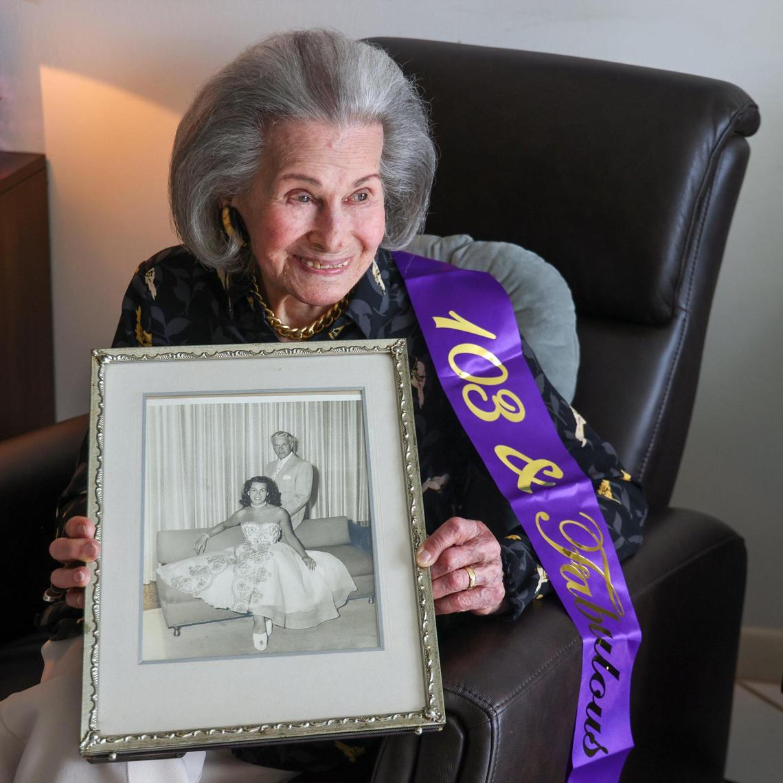 103-year-old Lucy Lowell, a Holocaust survivor, holds a photo of her and late husband after recalling her experience escaping Auschwitz, and going on to live a beautiful life in New York City and Miami Beach.