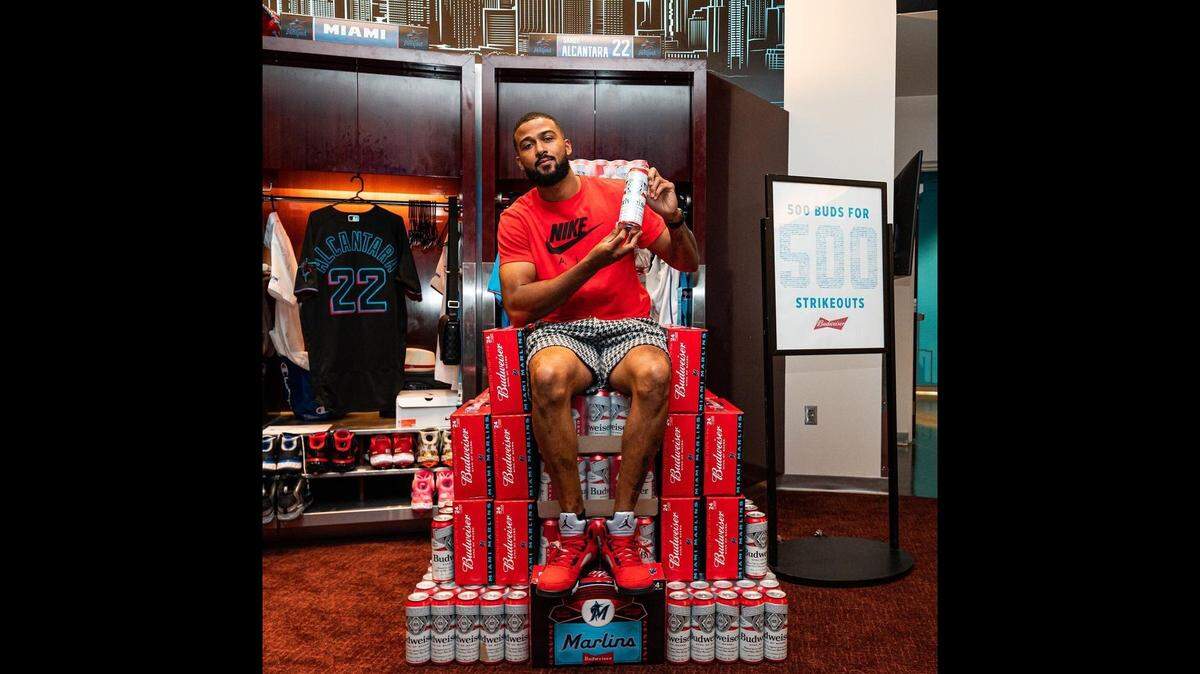 Miami Marlins pitcher Sandy Alcantara sits on a throne made of Budweiser beers at his locker in the loanDepot park clubhouse on Friday, June 3, 2022.