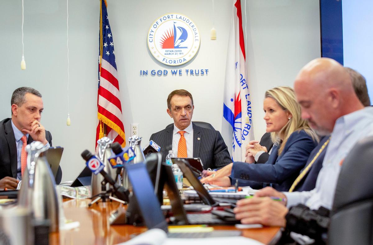 Fort Lauderdale Mayor Dean Trantalis, center, listens to city commissioners discuss solutions for the recent sewage spills at City Hall in Fort Lauderdale, Florida, on Tuesday, January 7, 2020.