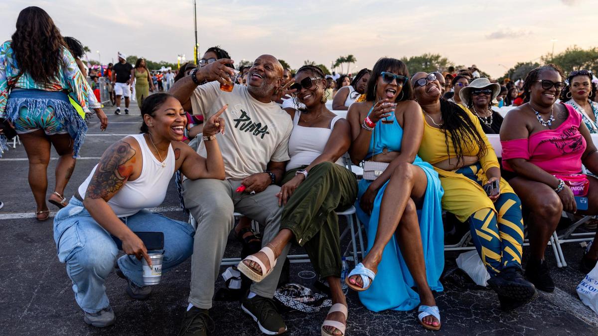 Festival goers react from their seats during Jazz in the Gardens at Hard Rock Stadium Arena in Miami Gardens, Florida, on Saturday, March 9, 2024.