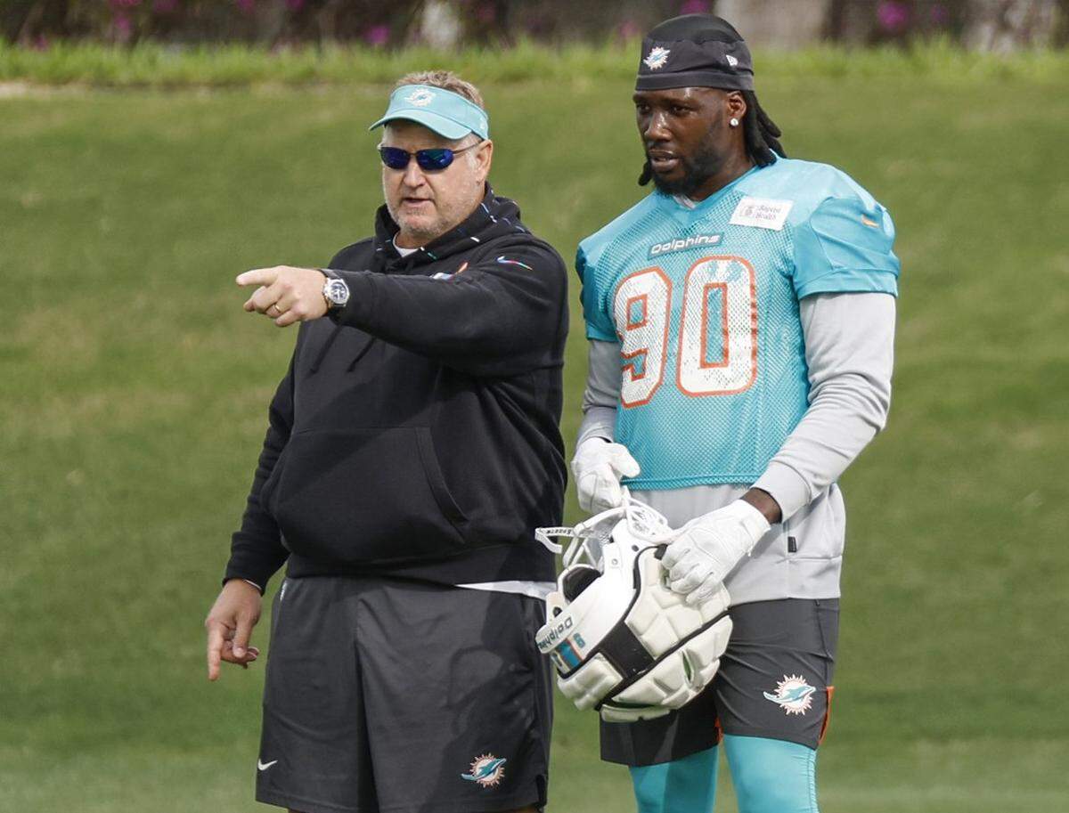 Miami Dolphins senior assistant coach Wade Harman interacts with linebacker Jason Pierre-Paul (90) during practice drills at Baptist Health Training Complex in Miami Gardens on Wednesday, November 29, 2023.