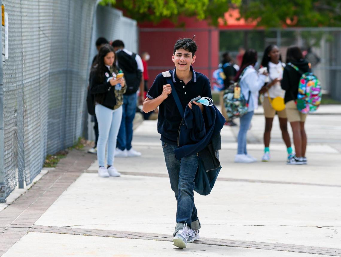 Gerardo Reina, 14, a ninth grader, leaves American Senior High School in Hialeah on the first day of in-person classes for Miami-Dade Public Schools, Monday, August 23, 2021. Due to the coronavirus pandemic, many students have not been in a classroom on campus since March 2020.