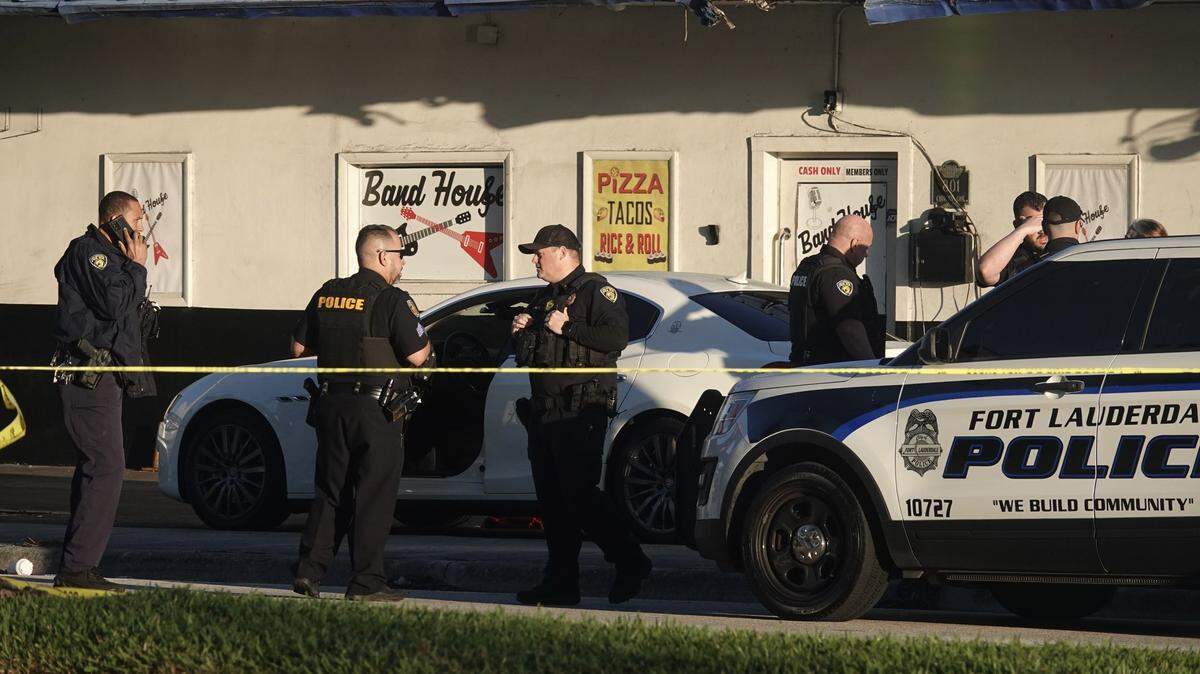 Fort Lauderdale police officers investigate a double shooting near Band House, 801 NE 62nd St., on the morning of Monday, Jan. 29, 2024.
