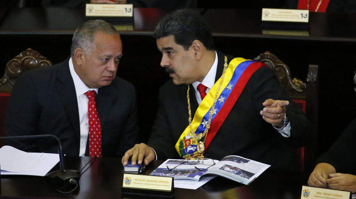 Venezuelan ruler Nicolás Maduro (right), and Diosdado Cabello, the head of the pro-government constituent assembly, were accused by the U.S. Department of Justice of participating in drug trafficking.