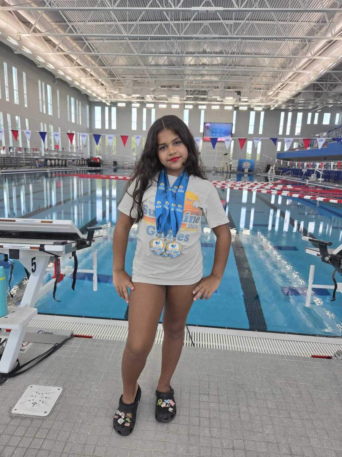 Jennifer Torres, 10, has been swimming at Milander Aquatic Center for two years. During that time, she has earned several gold medals in competitions and has been highly successful with her team, her grandmother, Malena Torres, said.