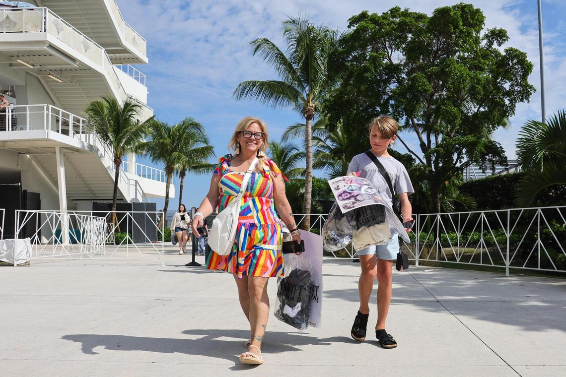 Kari Stewart of New Jersey and and her son Miles, 14, visit the Taylor Swift Eras Tour merchandise store at Hard Rock Stadium in Miami Gardens, Florida, Wednesday, October 16, 2024.