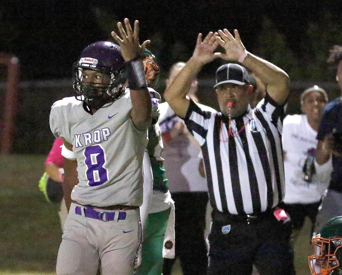 Dr. Michael M. Krop Lightning Frank Valbowtin (8) gestures after he scored a touchdown against McArthur Mustangs during football game on Friday, October 28, 2022 at Ives Estate Park in Miami. Andrew Uloza / for Miami Herald