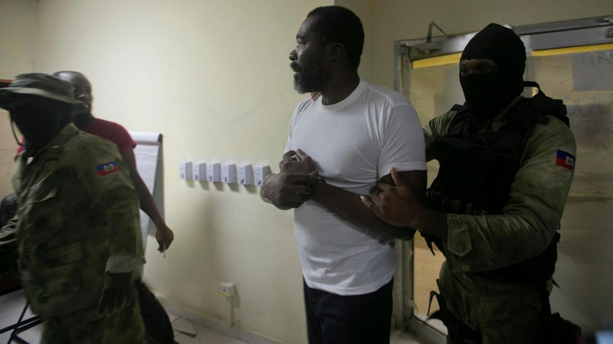 Former lawmaker Arnel Bélizaire, seen in this Dec. 4, 2019, photo as he was being escorted by Haiti National Police following his arrest, has been sanctioned by the government of Canada as part of its effort to crack down on gang violence in Haiti.