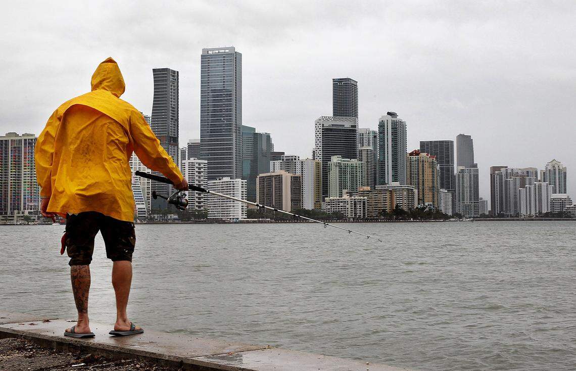 Fisherman Julio Hernandez throws his line from under the William M Powell Bridge in Key Biscayne, in a rainy afternoon as forecasters with the National Weather Service Miami said that South Florida will continue to see heavy rain through Monday, with about 3 to 4 inches forecast on the east coast and interior areas of the region and state authorities issued warnings of possible flooding and storm surge, on Saturday May 26, 2018.