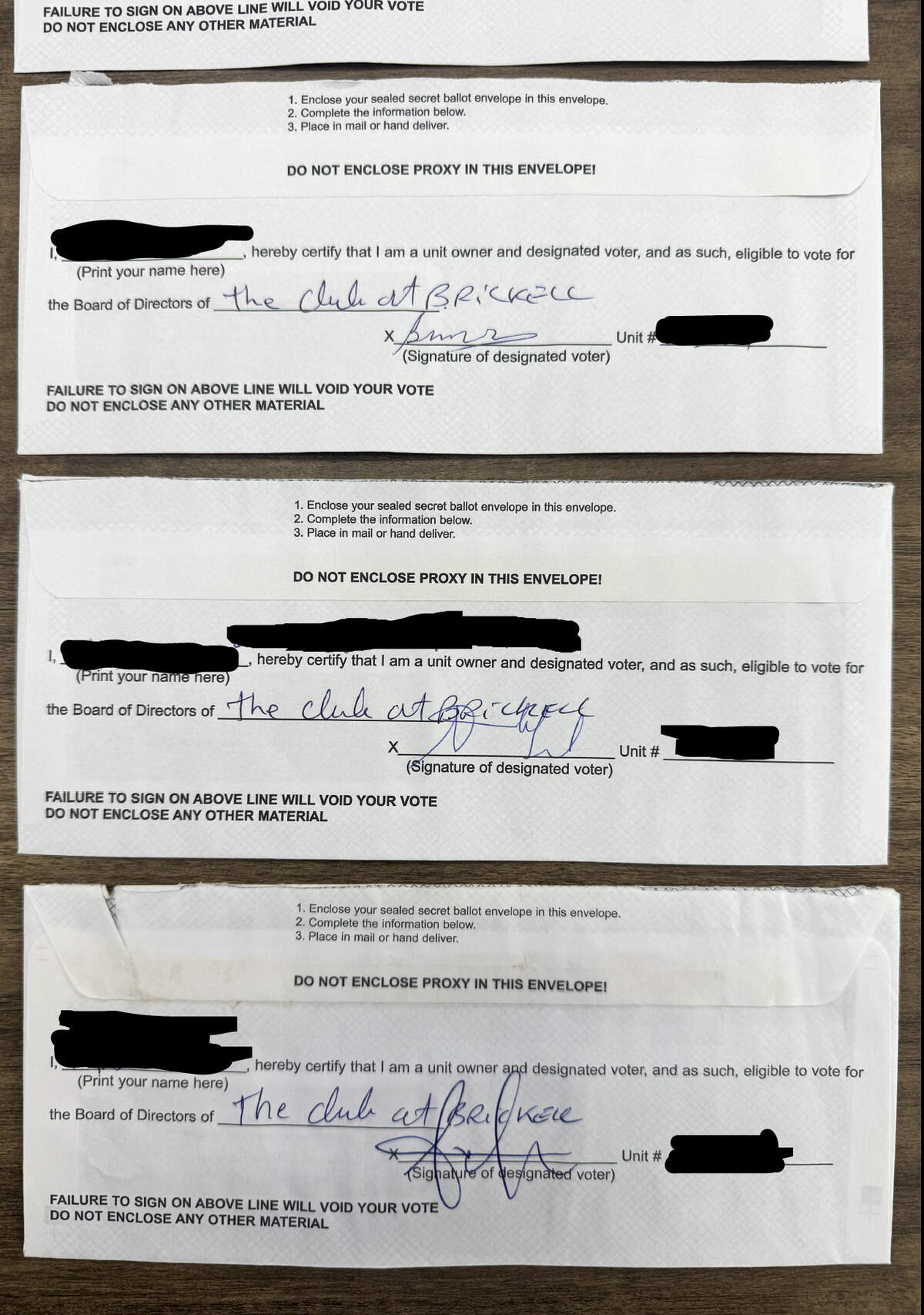 Ballots from the 2025 Club at Brickell Bay election. Some Club owners say the ballots were forged and show similar handwriting, and the word “Bay” is missing in the condo name line.
