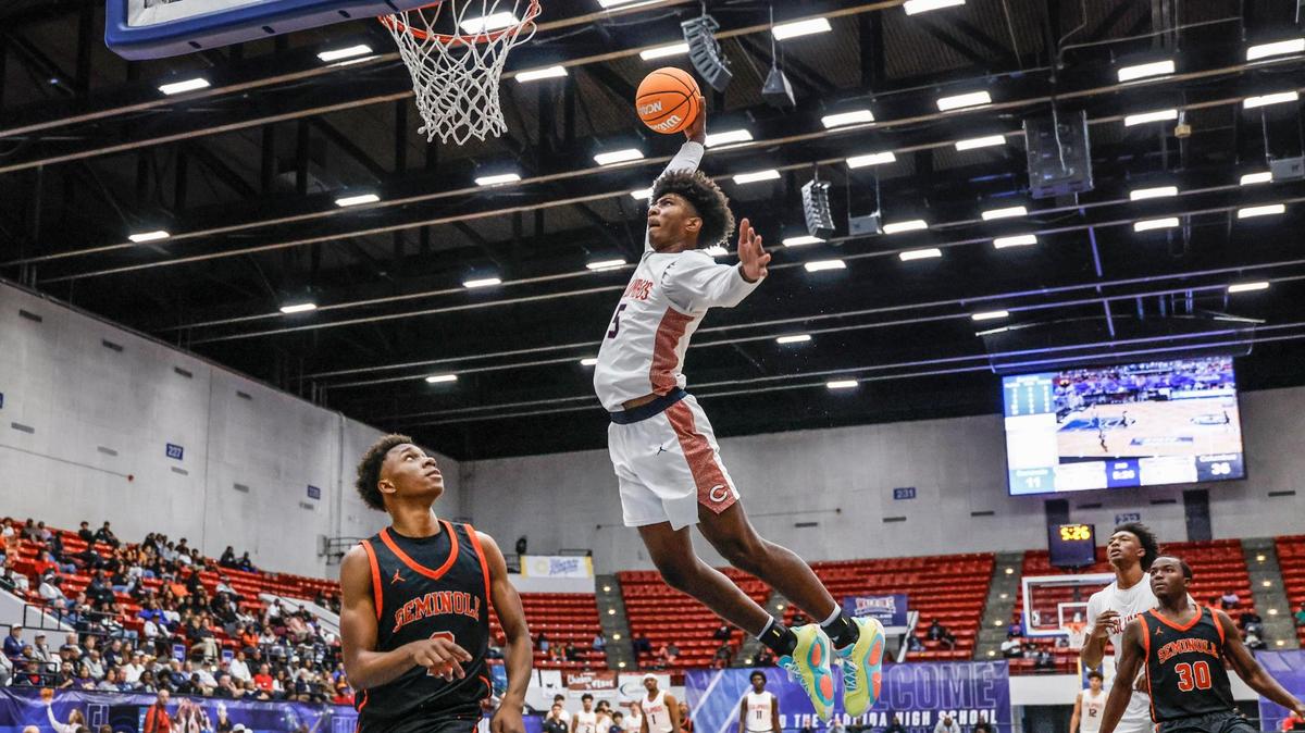 Columbus High School’s Jaxon Richardson (5) dunks the ball against Seminole High School in the first half for the FHSAA Class 7A Semi-Final for Boys High School Basketball State Championship at the RP Funding Center in Lakeland, Florida on Friday, March 7, 2025.