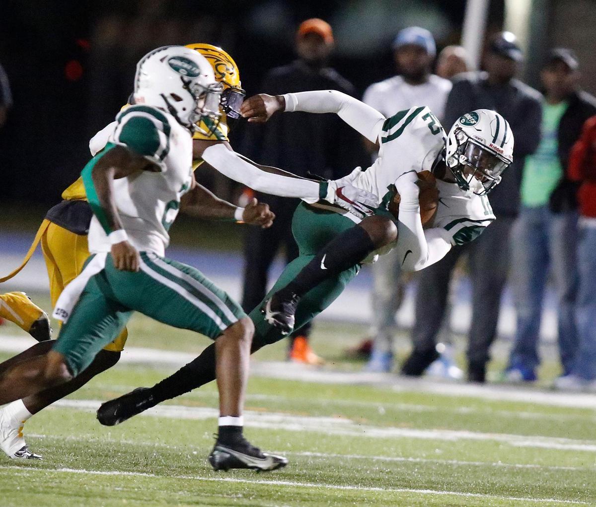 Miami Central Rockets quarterback Keyone Jenkins (12) is taken down by Killian Cougars defender during the FHSAA Region 4-5A high school football championship on Saturday, November 27, 2021 at Tropical Park in Miami. Andrew Uloza / for THE MIAMI HERALD