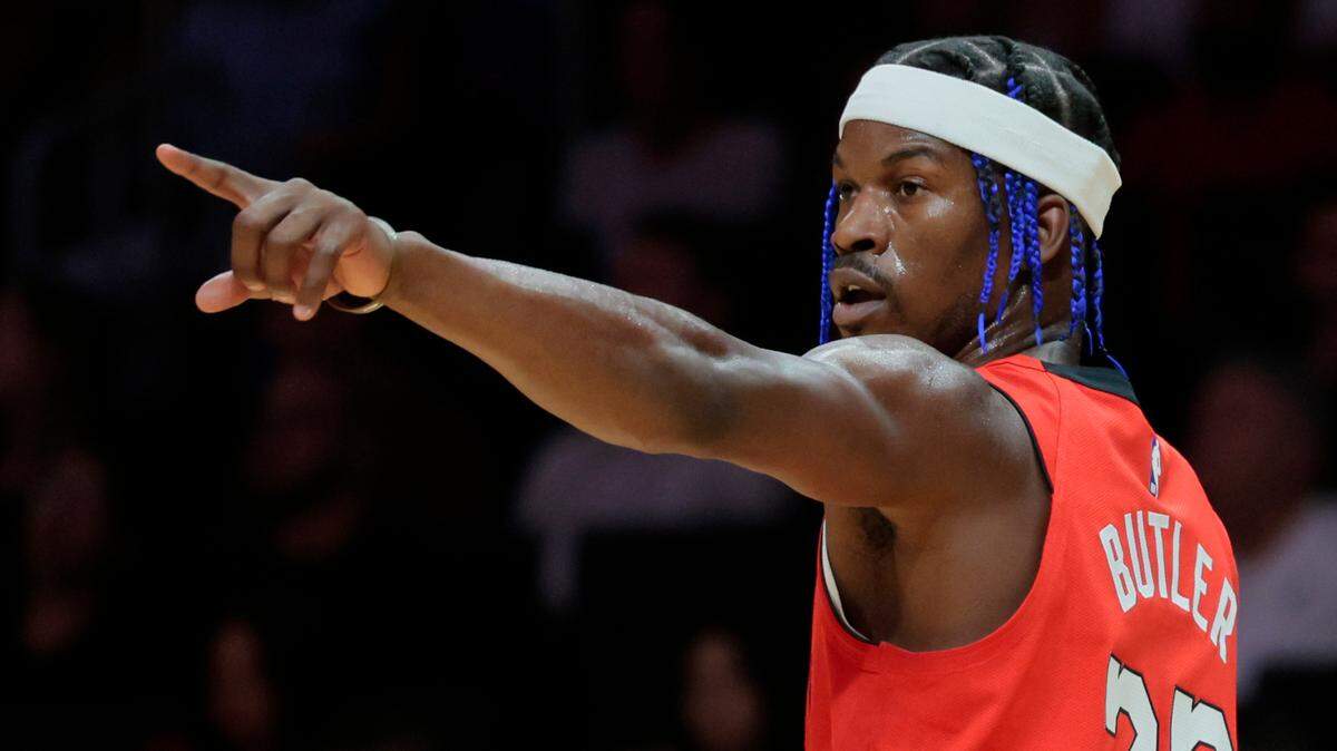 Miami Heat forward Jimmy Butler (22) signals on the court during the game against the Phoenix Suns at Kaseya Center in Miami on December 7, 2024.