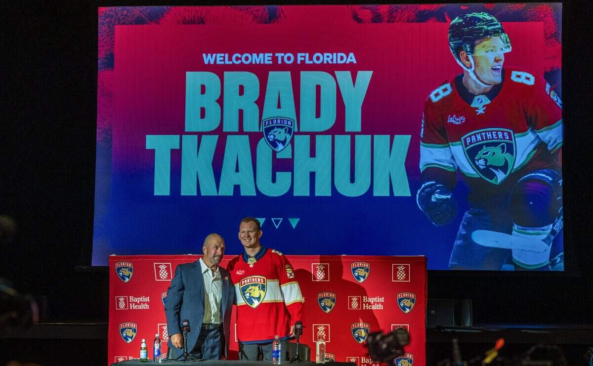 Bill Zito (left), President of Hockey Operations & General Manager pose with the new Florida Panthers' forward Brady Tkachuk, during a press conference at the War Memorial Auditorium in Fort Lauderdale, on Tuesday June 23, 2026.