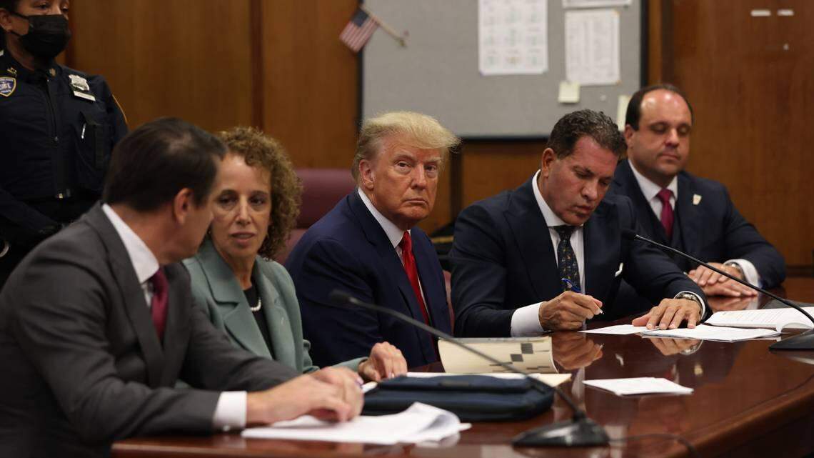 Former President Donald Trump sits at the defense table with his defense team in a Manhattan court, Tuesday, April 4, 2023, in New York.