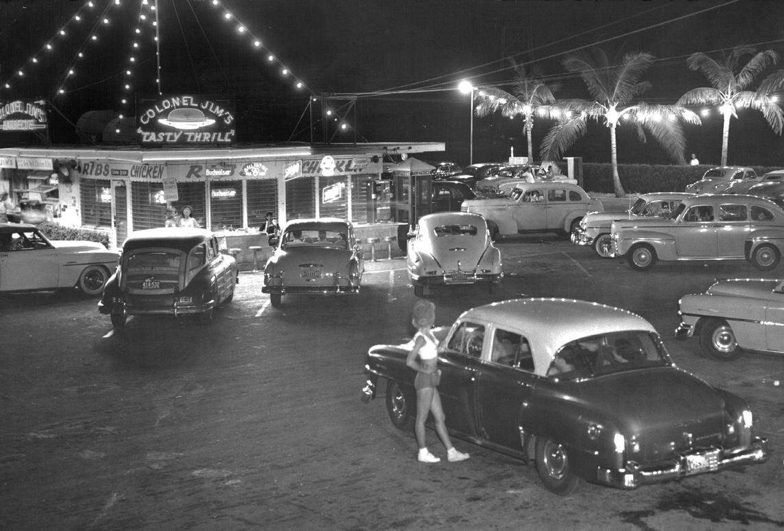 In 1952, a car hop at Colonel Jim’s Tasty Thrill drive-in on the 79th Street Causeway.