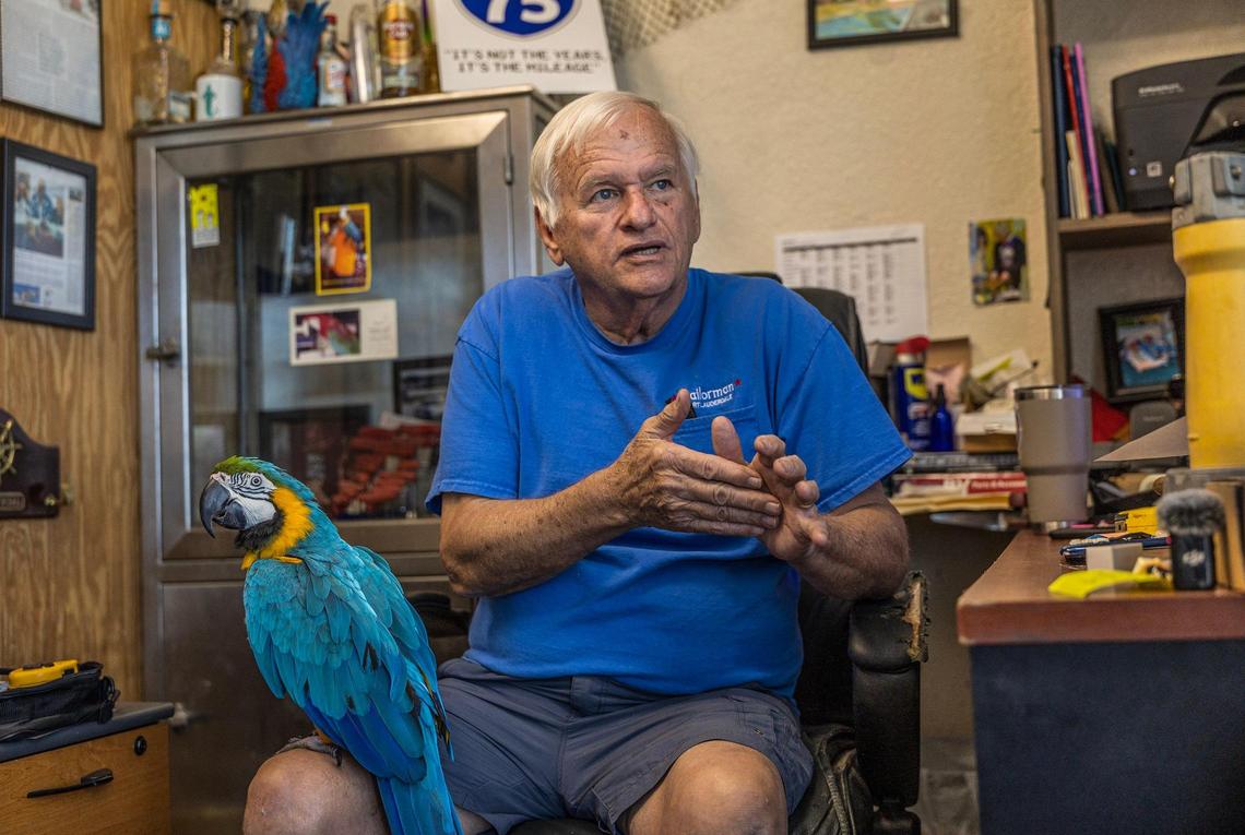Chuck Fitzgerald, owner of Sailorman, with Cisco the parrot, the store’s mascot.