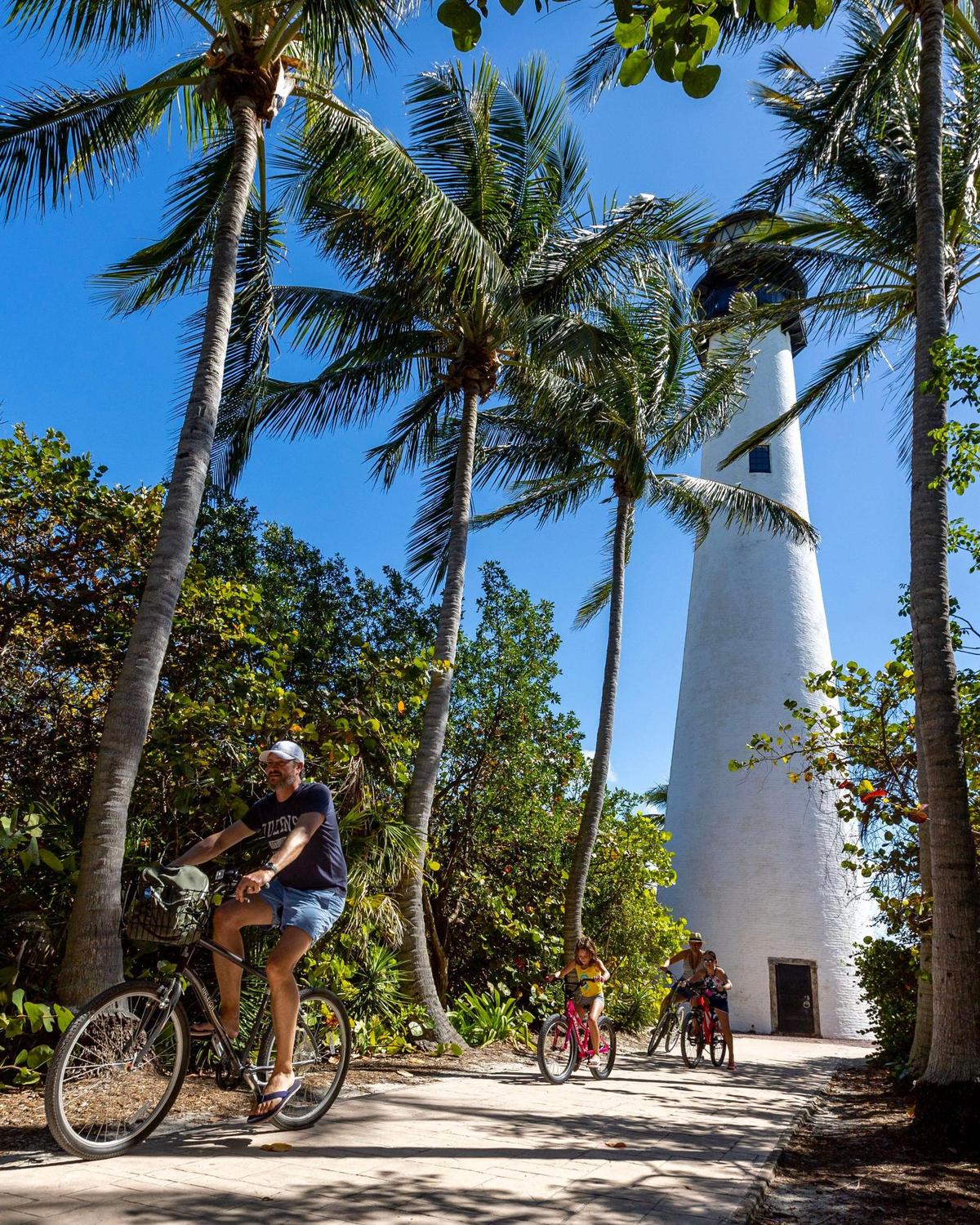 The Zeh family goes for a bike ride at Bill Baggs Cape Florida State Park in Key Biscayne, Florida, on Wednesday, Feb. 22, 2023.