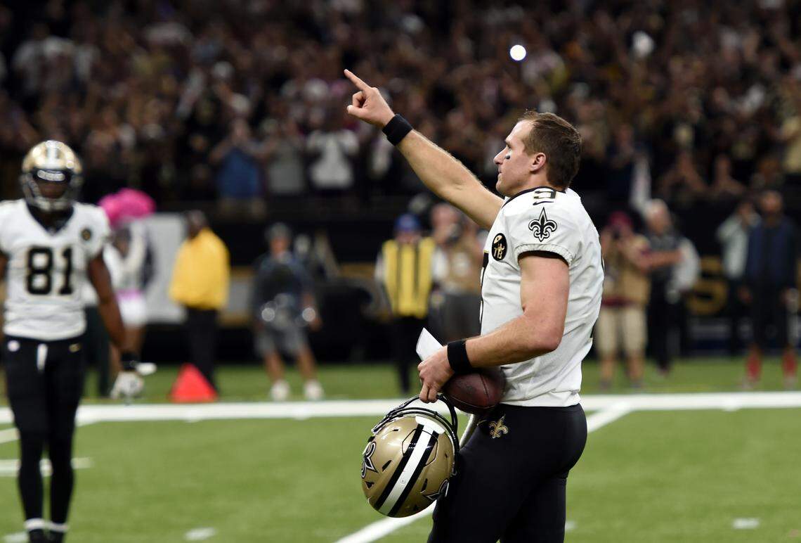 New Orleans Saints quarterback Drew Brees (9) reacts after breaking the NFL all-time passing yards record in the first half of an NFL football game against the Washington Redskins in New Orleans, Monday, Oct. 8, 2018.
