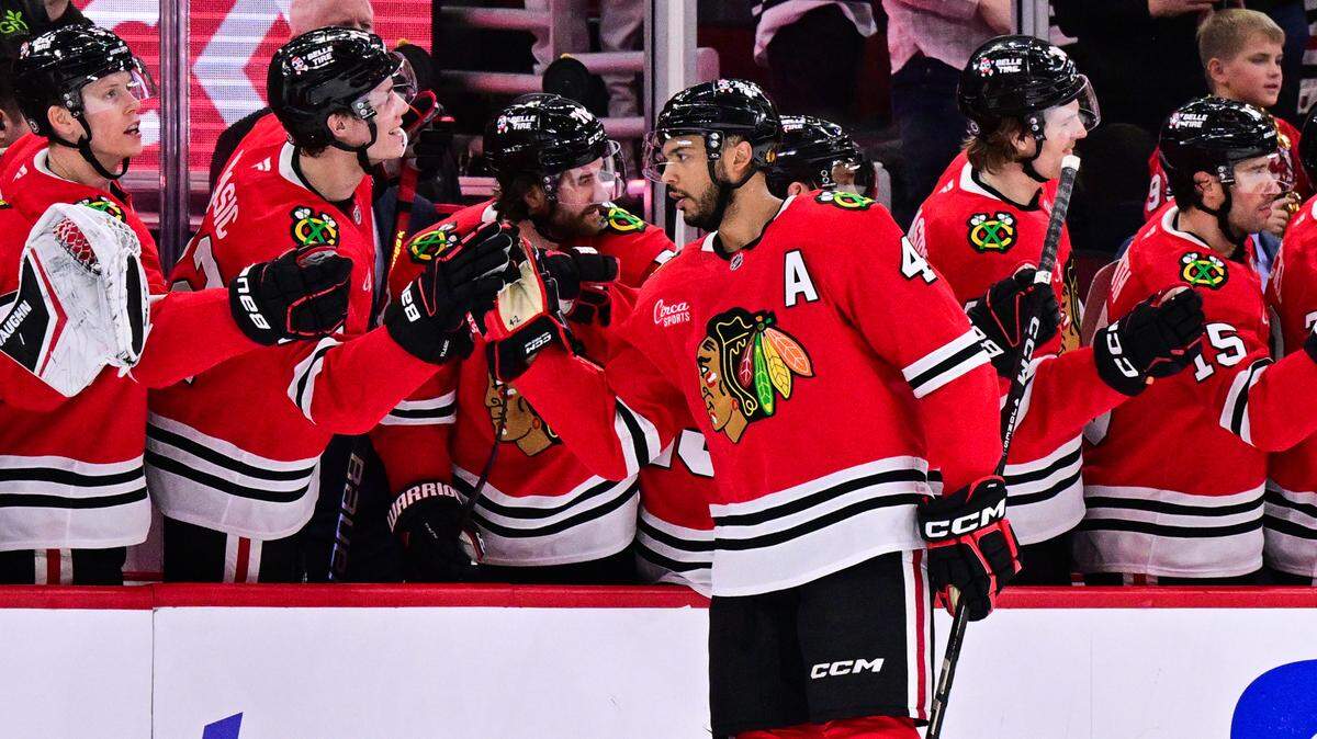 Feb 7, 2025; Chicago, Illinois, USA; Chicago Blackhawks defenseman Seth Jones (4) celebrates his goal against the Nashville Predators during the second period at the United Center. Mandatory Credit: Daniel Bartel-Imagn Images