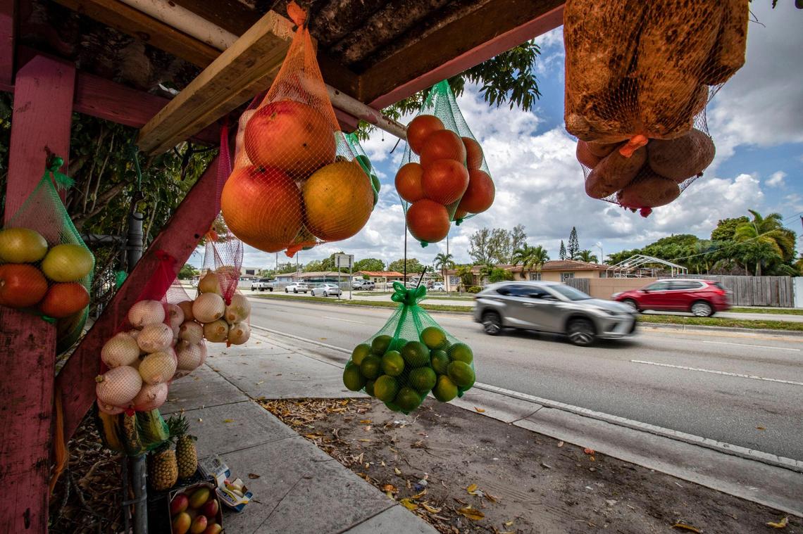 A vendor’s fruit and vegetables are displayed for drivers along East 4th Avenue in the City of Hialeah on Saturday, May 16, 2021.