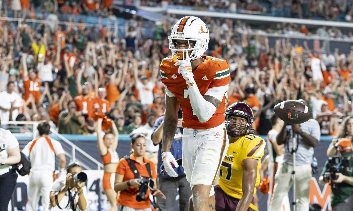 Miami Hurricanes wide receiver CJ Daniels (7) reacts after catching a touchdown pass against Bethune-Cookman Wildcats in the first half of their NCAA football game at Hard Rock Stadium on Saturday, Sept. 6, 2025, in Miami Gardens, Fla.