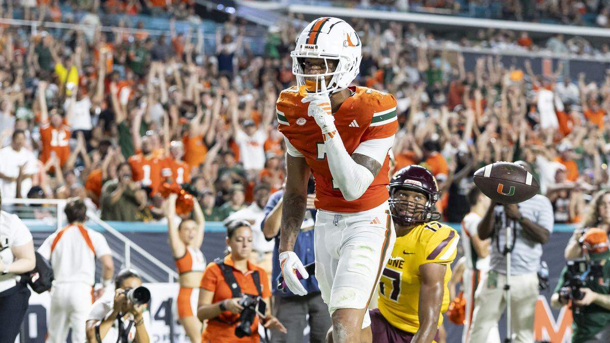 Miami Hurricanes wide receiver CJ Daniels (7) reacts after catching a touchdown pass against Bethune-Cookman Wildcats in the first half of their NCAA football game at Hard Rock Stadium on Saturday, Sept. 6, 2025, in Miami Gardens, Fla.