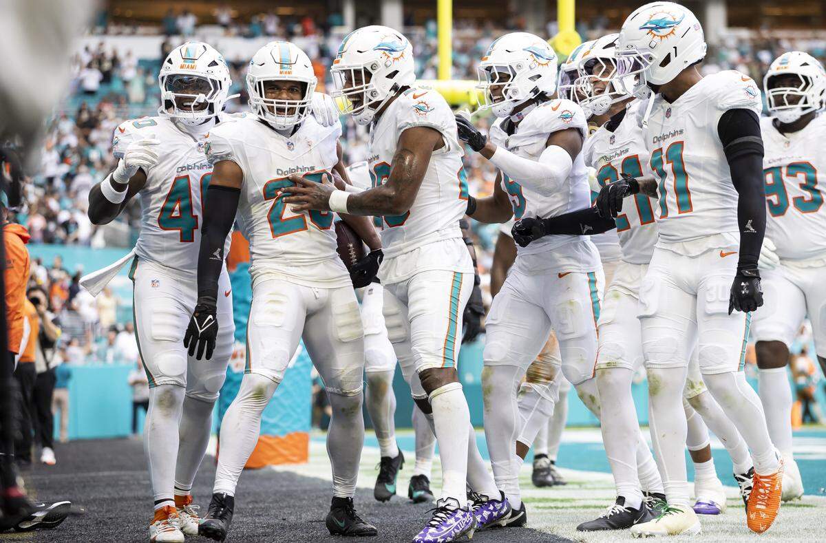 Miami Dolphins safety Minkah Fitzpatrick (29) celebrates after intercepting the ball and running back a two point conversion against the New Orleans Saints in the second half of their NFL game at Hard Rock Stadium on Sunday, Nov. 30, 2025, in Miami Gardens, Fla.