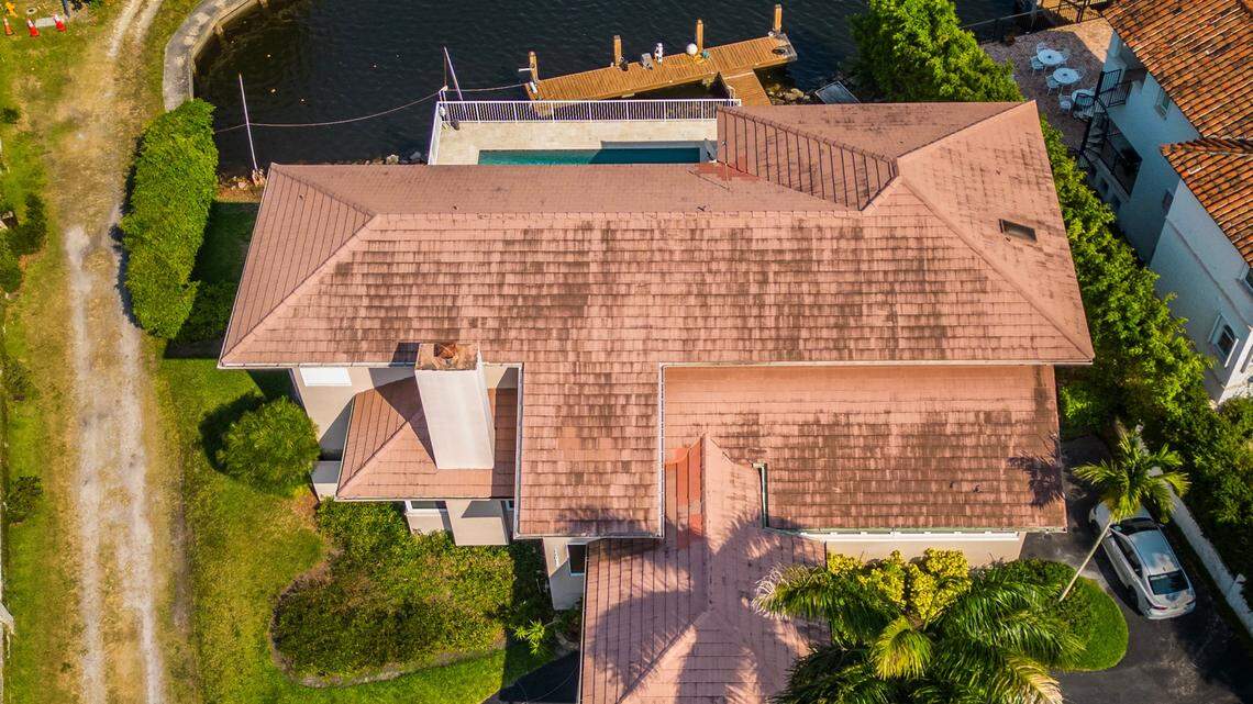 View of the Coral Gables home at 11025 Tanya St. where police say a boat matching the description of the vessel that struck and killed Ella Adler near Nixon Beach Sandbar on Saturday was located and seized from the deck in the home back canal, in Coral gables, on Tuesday, May 14, 2024.