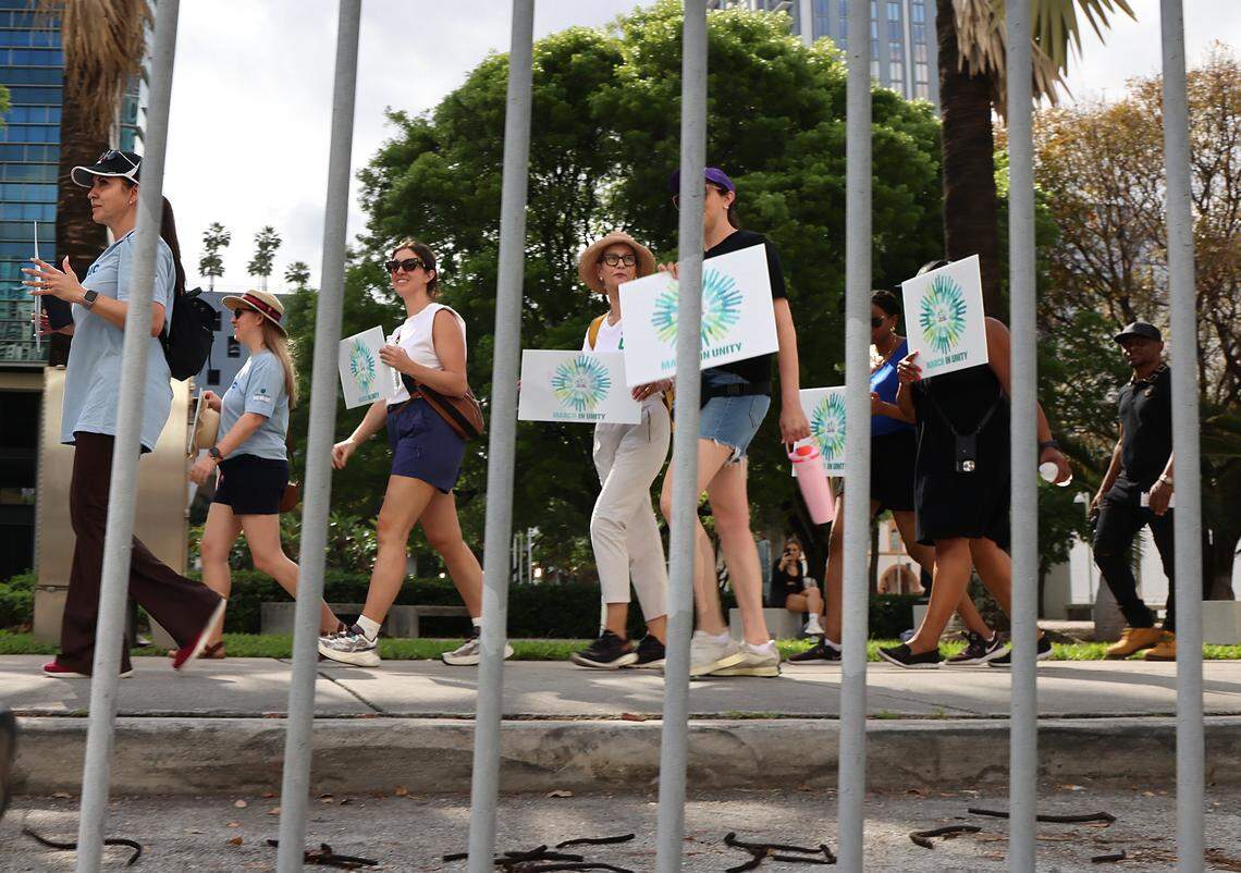 Meg Daly, the founder and executive chair of The Underline, center, walks along side of marchers participating in the Miami Unity March that brought together Miami's civic, faith, cultural, and nonprofit communities to reaffirm the importance of unity on Sunday, April 19, 2026, in Miami, Florida.