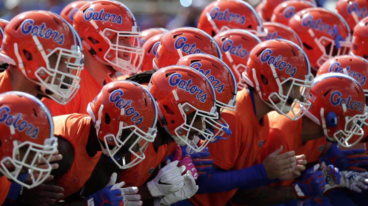 Florida players warm up before an NCAA college football game against LSU in 2018, in Gainesville, Fla.