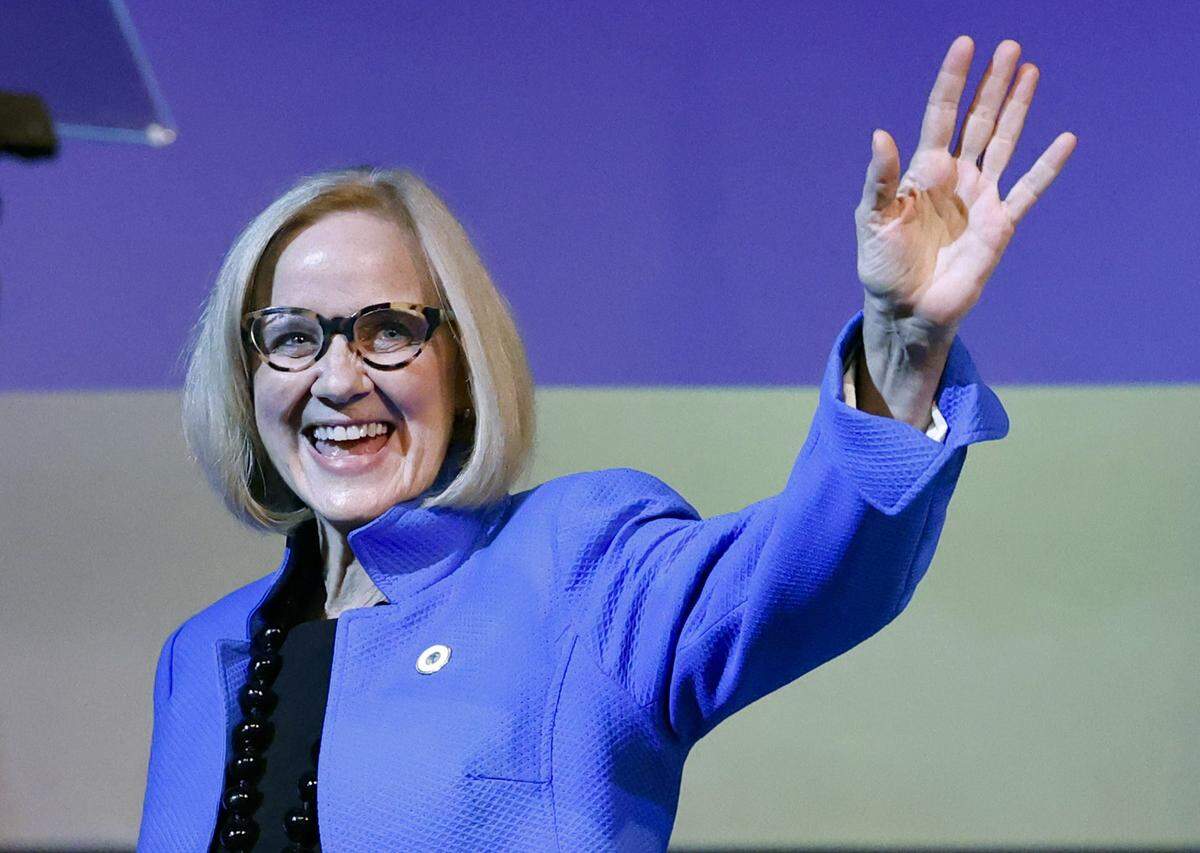 Eileen Higgins waves to the audience during the installation ceremony as the Mayor of the City of Miami at the Miami-Dade College Wolfson Campus Auditorium in Miami, Florida, on Thursday, December 18, 2025. 