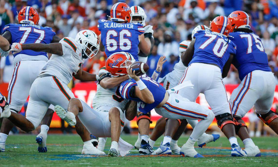 Miami Hurricanes defensive lineman Tyler Baron (9) sacks Florida Gators quarterback Graham Mertz (15) in the second half of an NCAA college football game at Ben Hill Griffin Stadium in Gainesville, Florida, on Saturday, August 31, 2024.