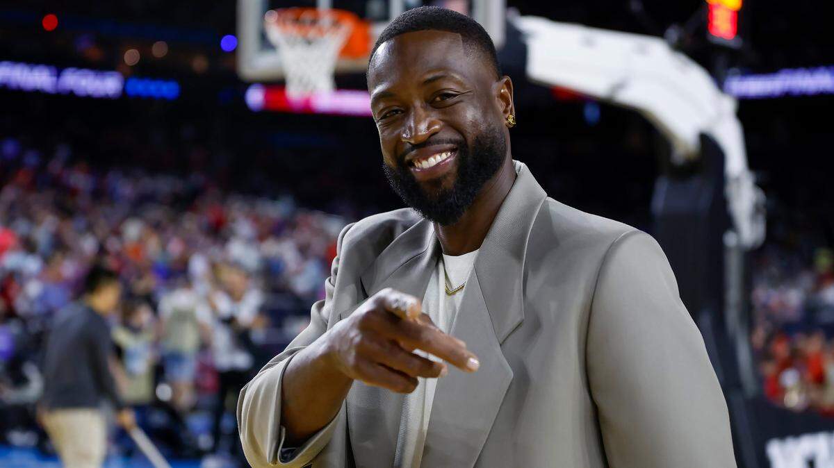 Miami Heat legend Dwyane Wade smiles during the first half of the Men’s Basketball Championship National Semifinal between the Florida Atlantic Owls against the San Diego State Aztecs at NRG Stadium in Houston, Texas on Saturday, April 1, 2003.